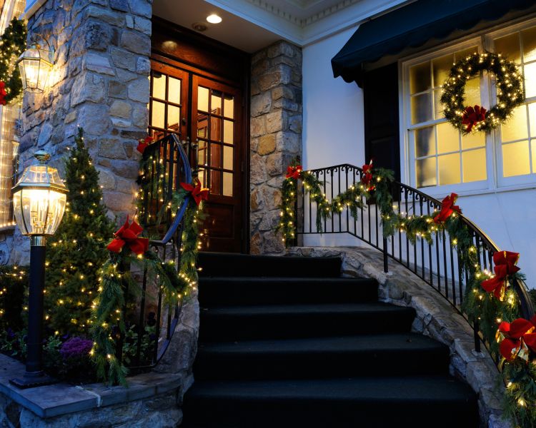 Beautifully decorated home entrance with professional-grade Christmas lights by Mammoth Lights in Chester County, PA.