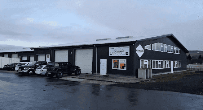 vehicle covered by white in garrage