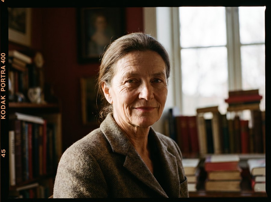 A photographer at her desk, choosing the frame