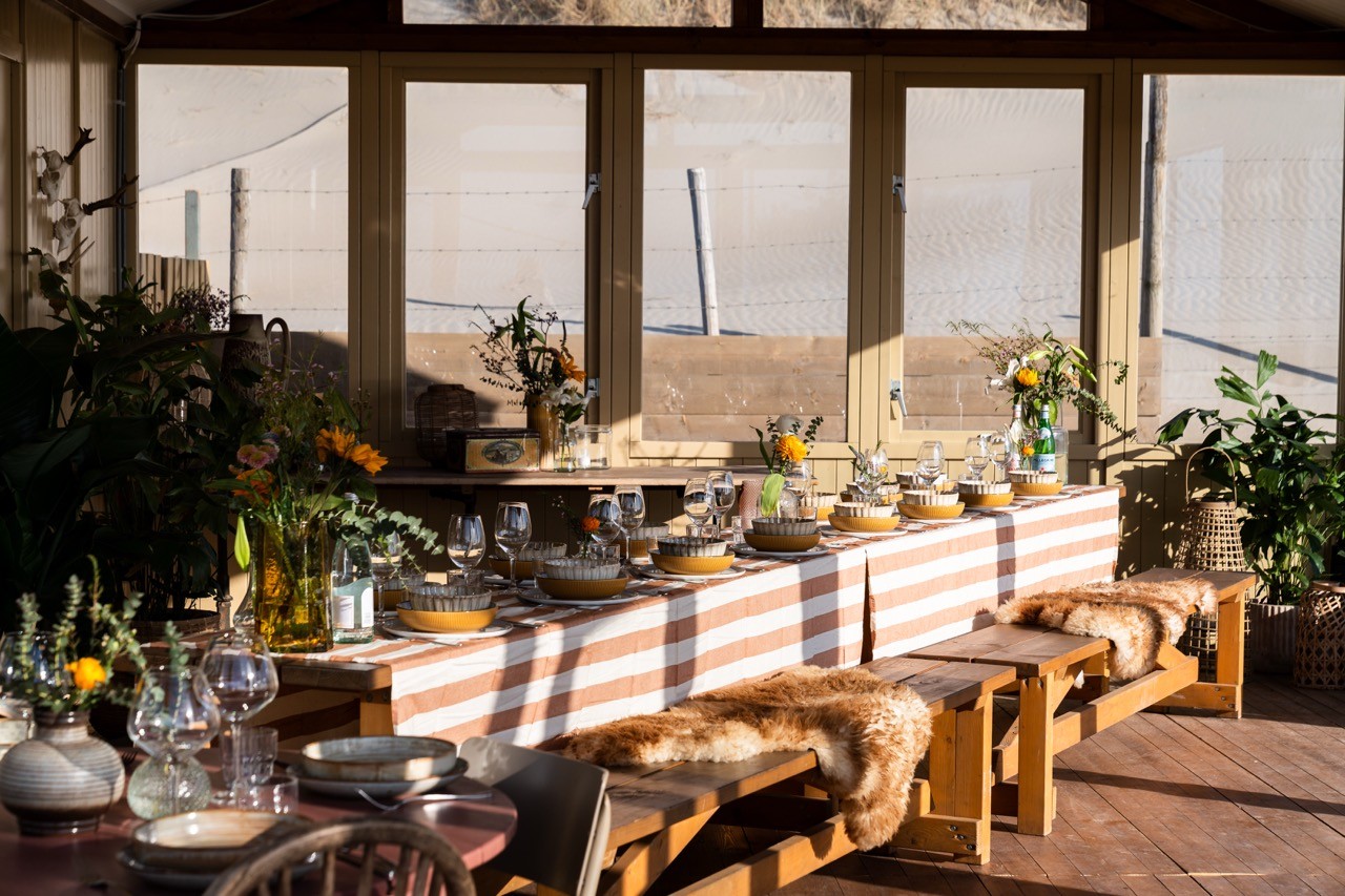 Scandinavian bohemian inspired interior of a beachclub with flowers