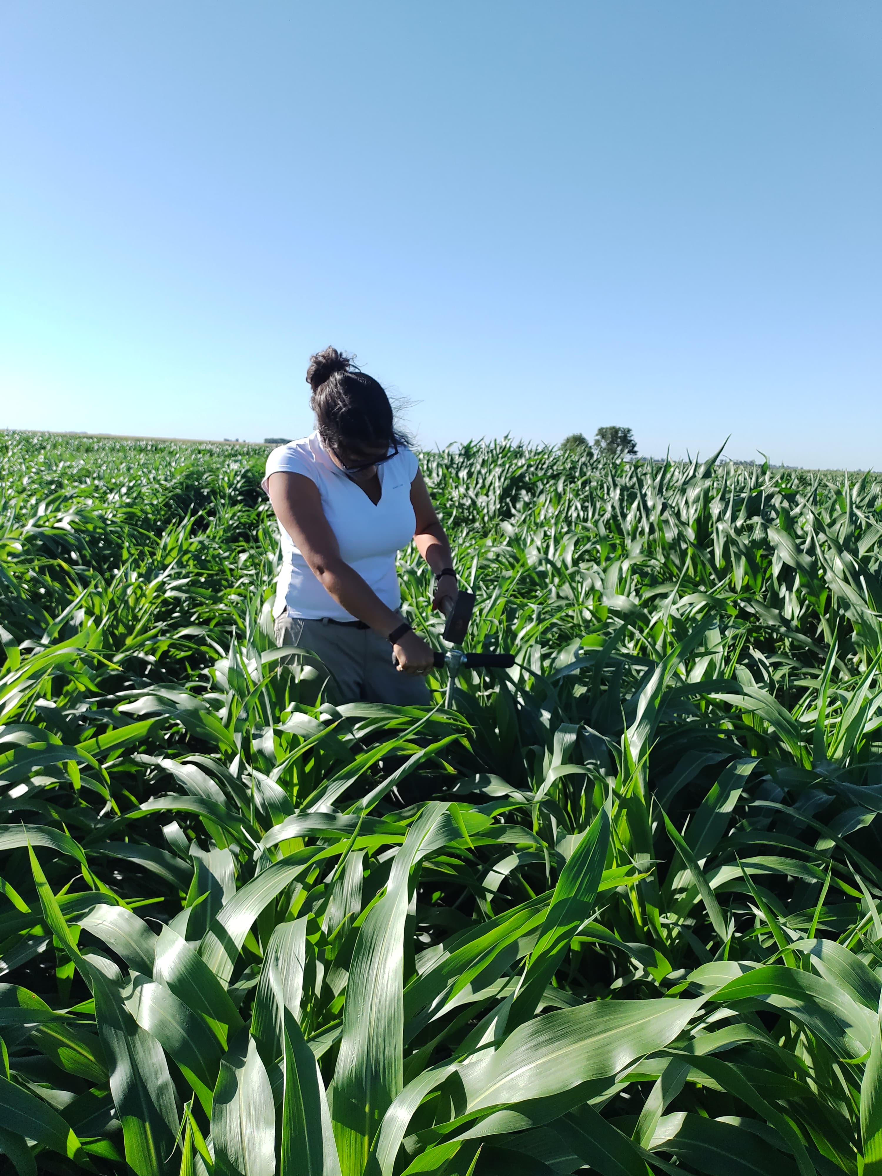a man and a woman shaking hands in front of a laptop