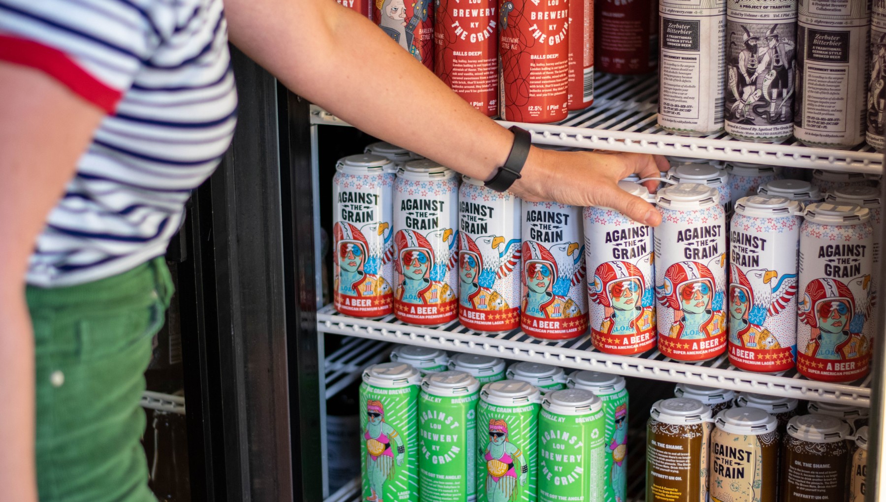 Image of the Against the Grain cans in cooler