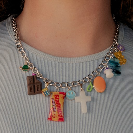 charm necklace on woman