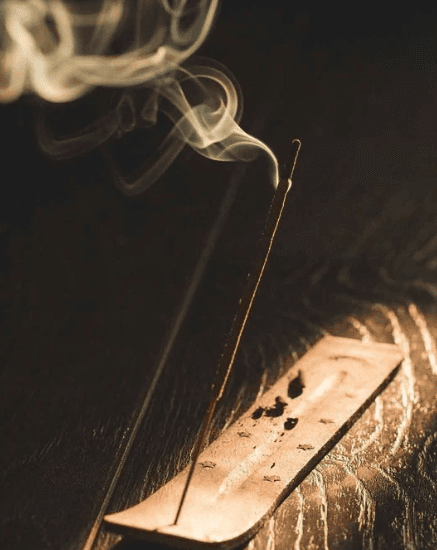 a group of women standing on top of a sandy beach