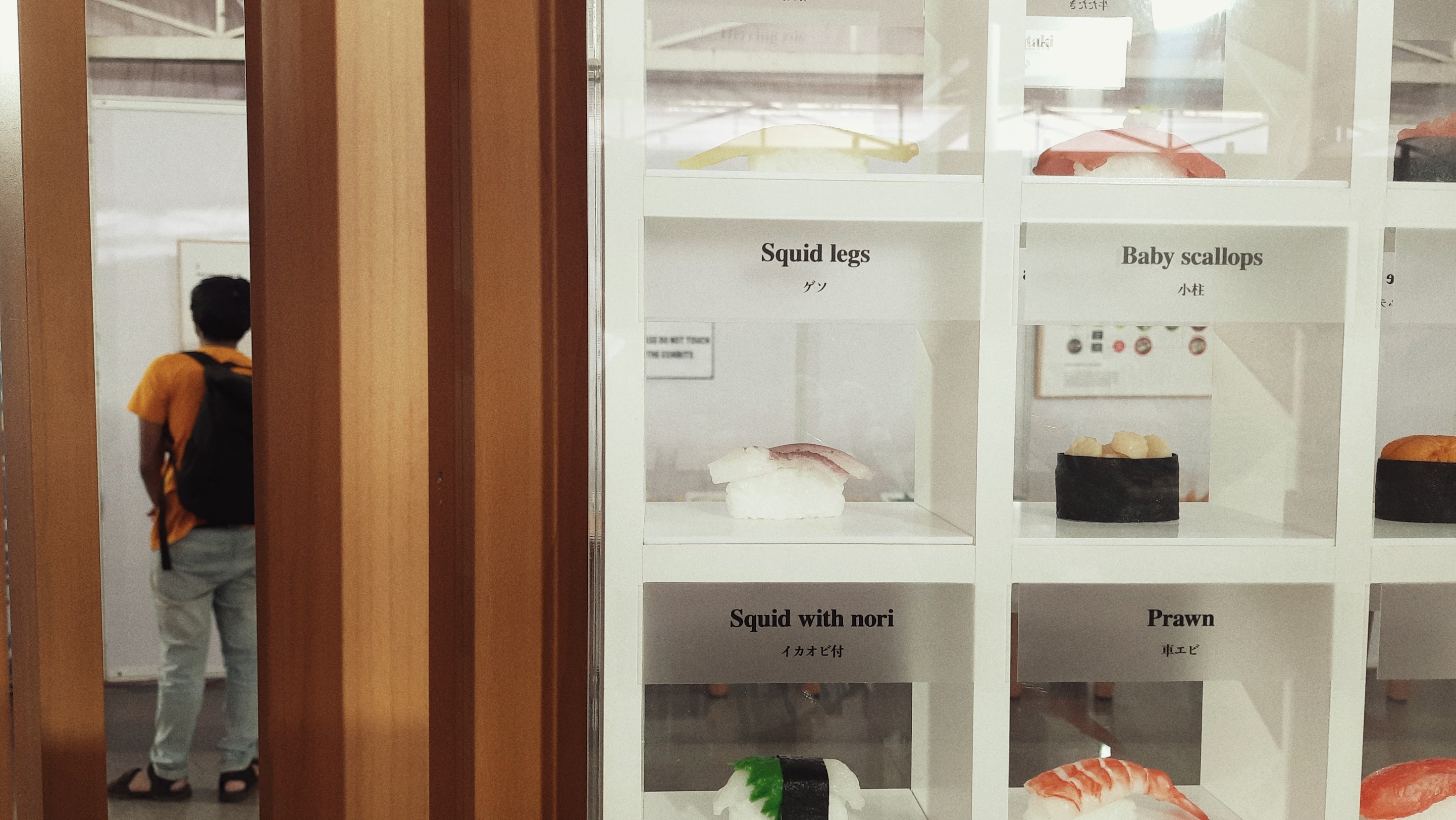 a japanese style building with a japanese roof and trees around it