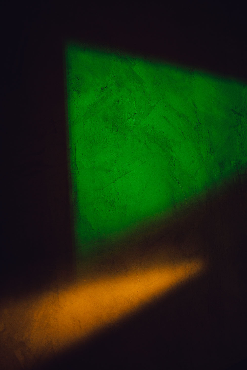 Splashes of color on the wall in the washroom hallway at Particle Studio in Seattle, WA.