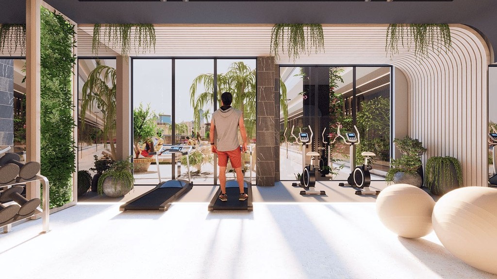 Contemporary gym in a modern apartment at Samana Miami, highlighting minimalist design and open space.