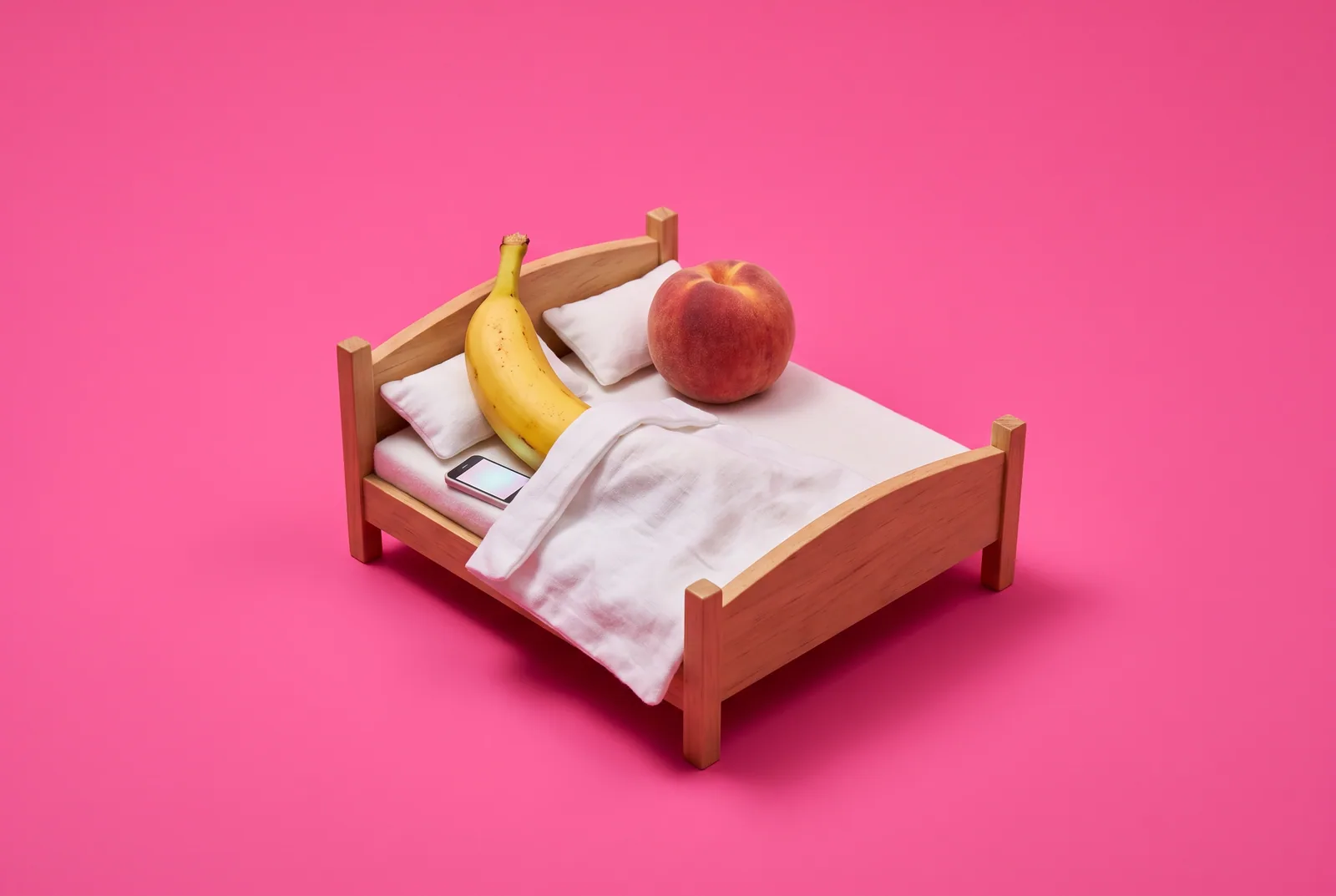 Two cherries joined at the stem on a pink backdrop, one turned toward a glowing blank phone, illustrating my boyfriend watches porn