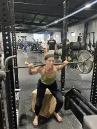 man in black hoodie standing