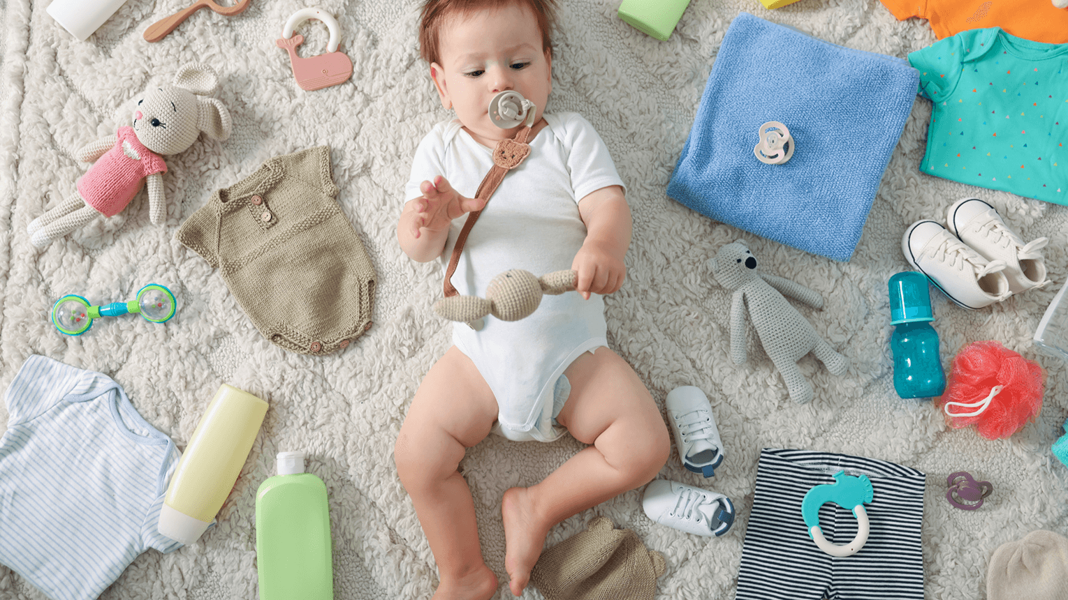 baby with lots of items around them