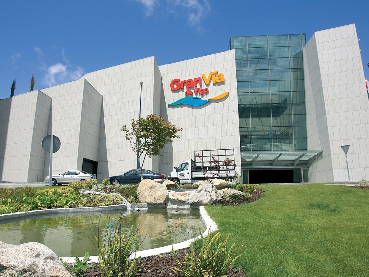 Rooftops of a coastal town with the sea in background