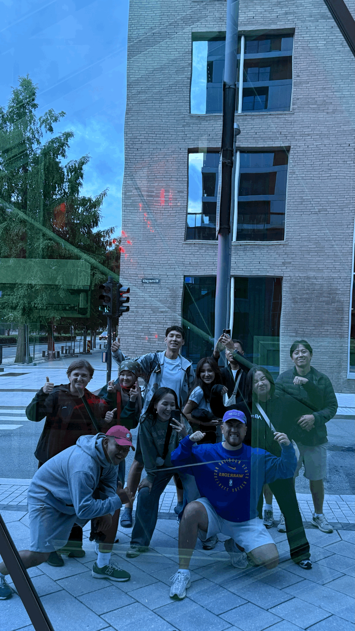 two people sitting on a bench looking at a mountain