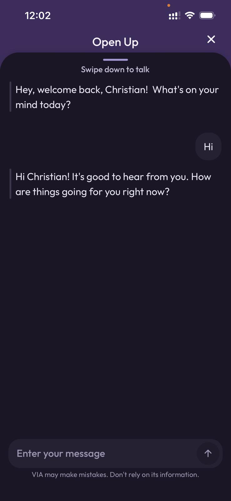 Smartphone mockup displaying the "Open Up" chat interface within the Vialog app. The screen shows a text conversation where the AI companion, Via, greets the user Christian and asks about his wellbeing. The interface includes a "Swipe down to talk" indicator at the top and a message input field at the bottom.