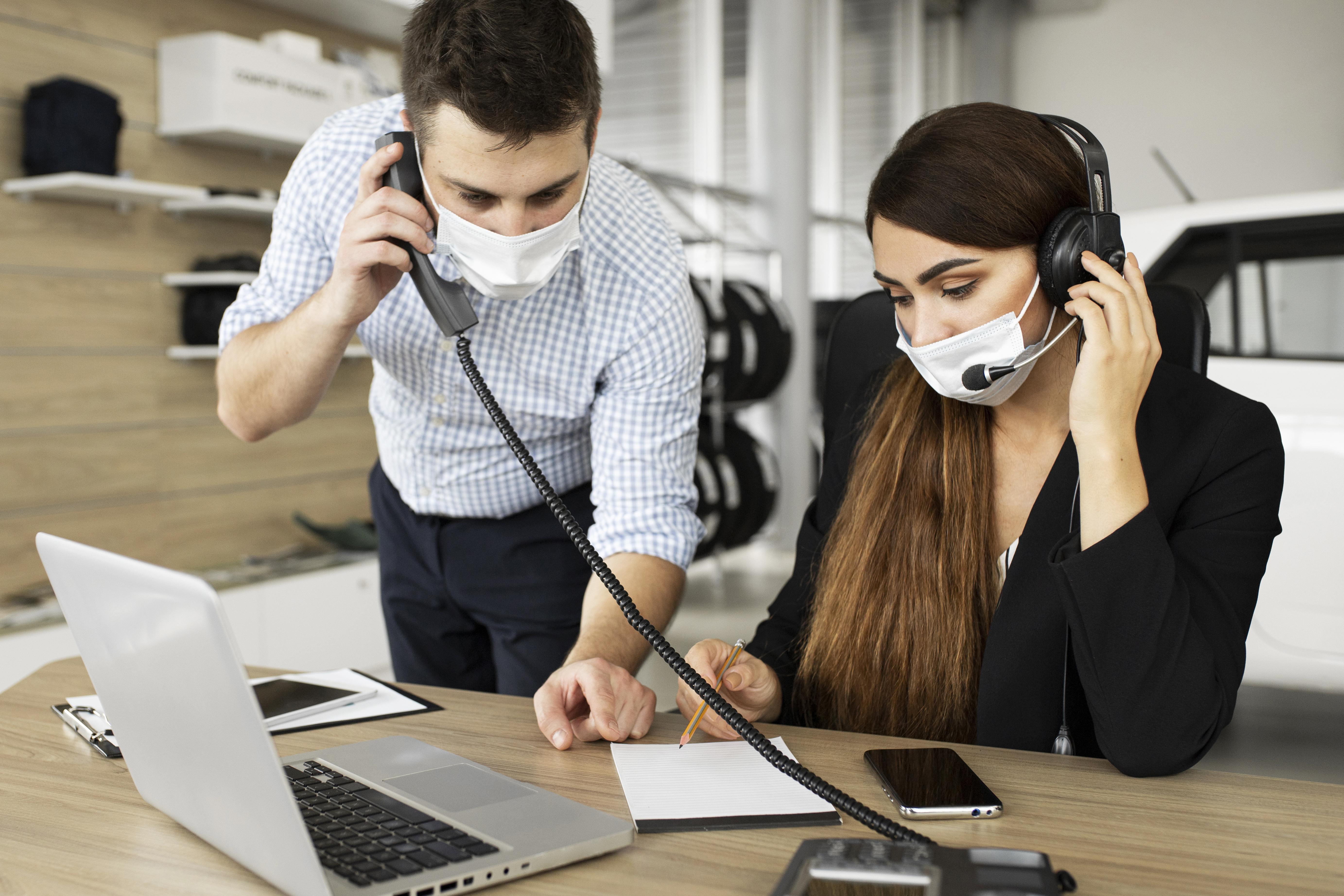 Two surgeons working in a hospital with the hands of a human heart