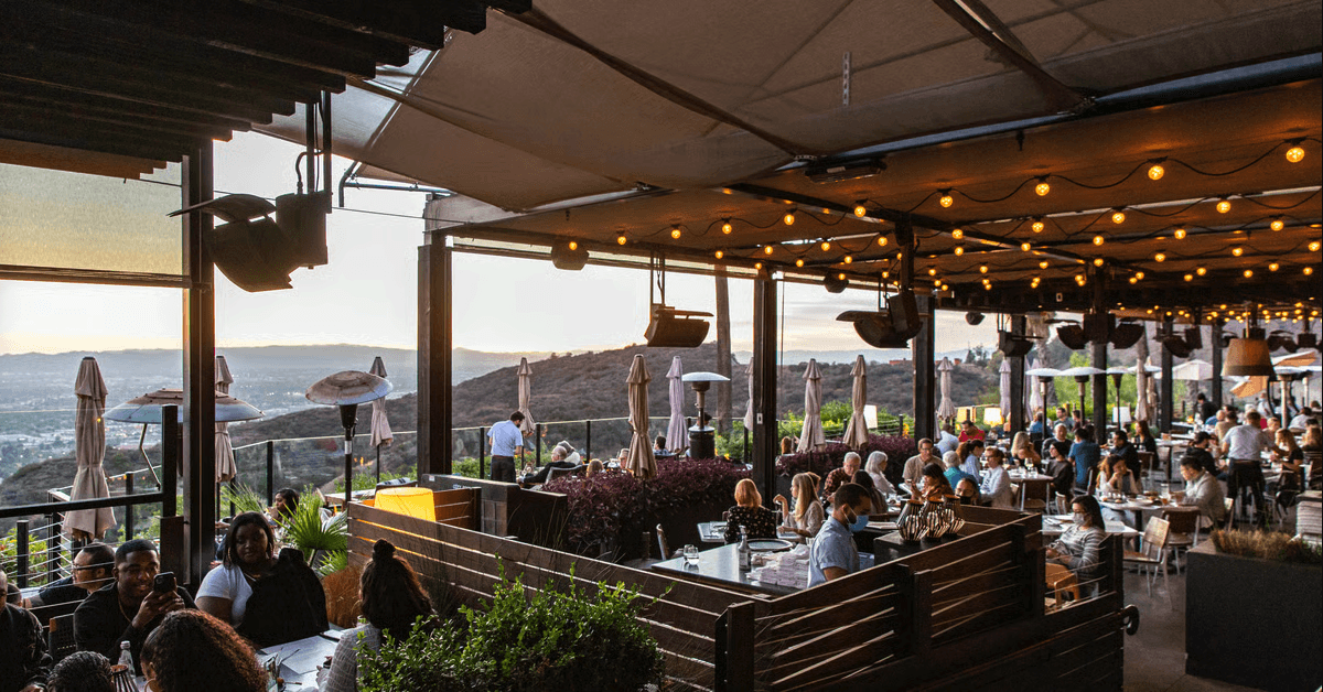 castaway burbank with patrons eating outside with majestic view