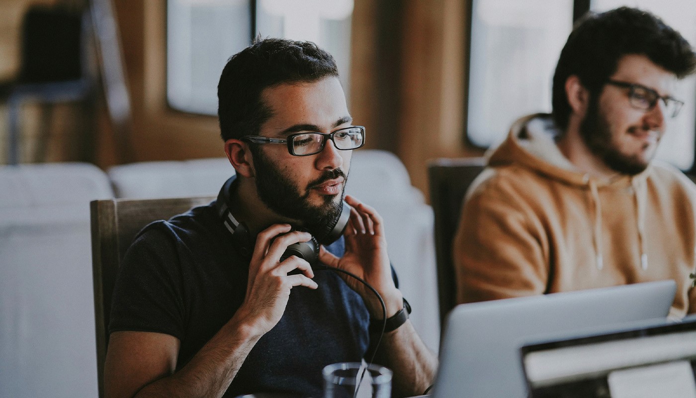 man sitting beside woman looking at a contract on DocuSign