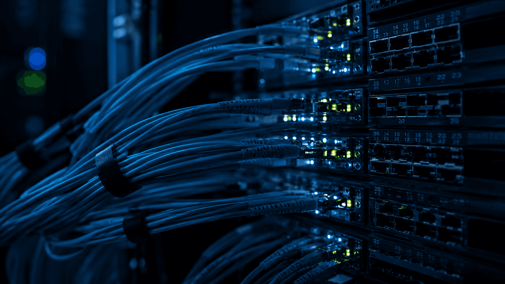 Macro shot of fiber optic cables and network switches demonstrating high-speed CRM data orchestration and automated sales pipelines.