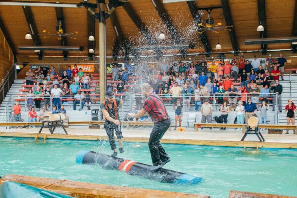 two lumberjacks battling it out at the lumberjack feud dinner theatre in Pigeon Forge