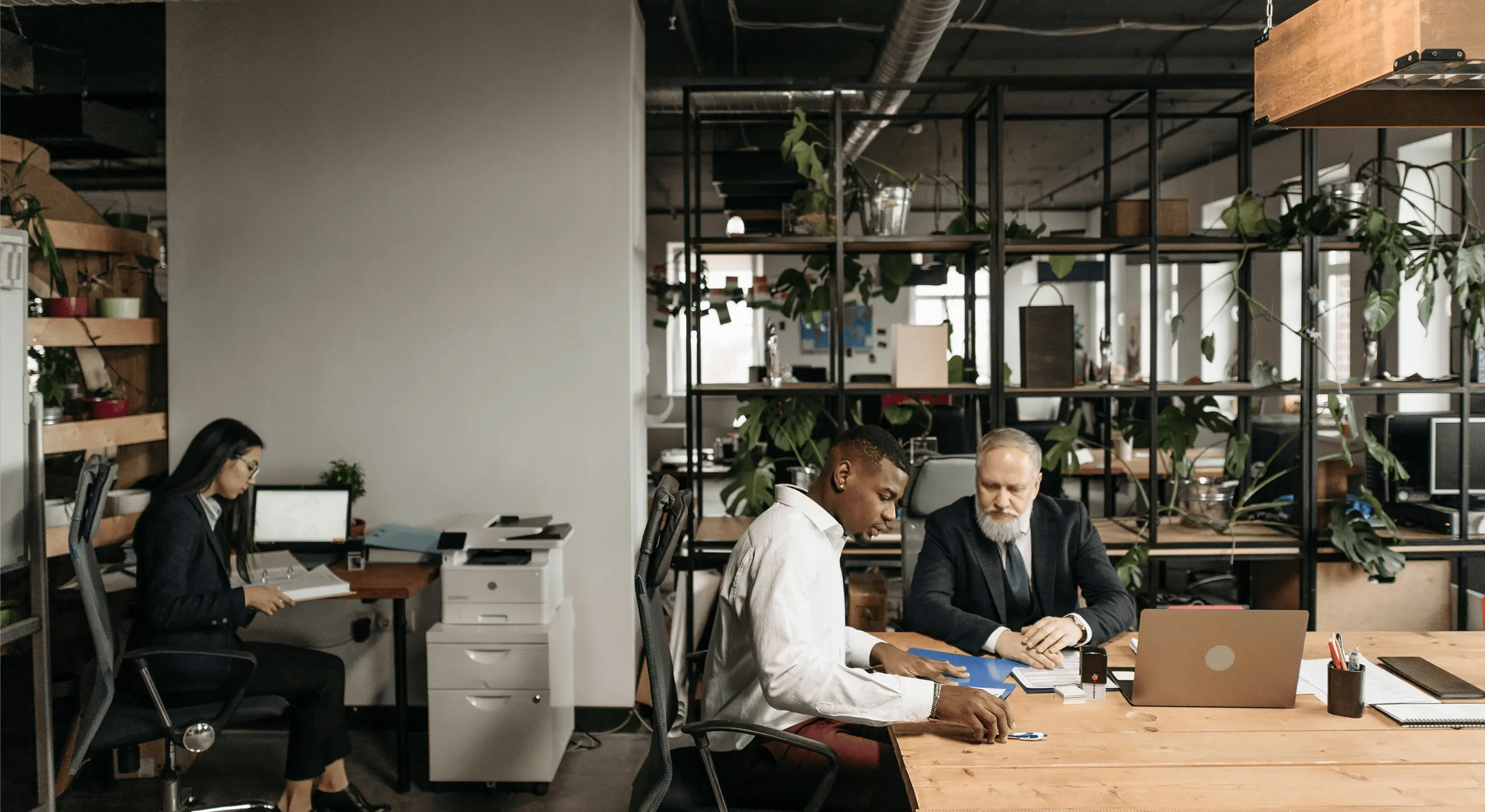 Professionals collaborating in a coworking space.
