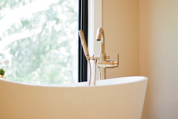 White standing tub with silver faucet