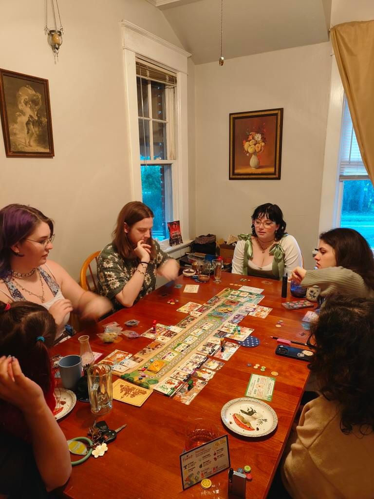people in a large building with Tate Modern in the background