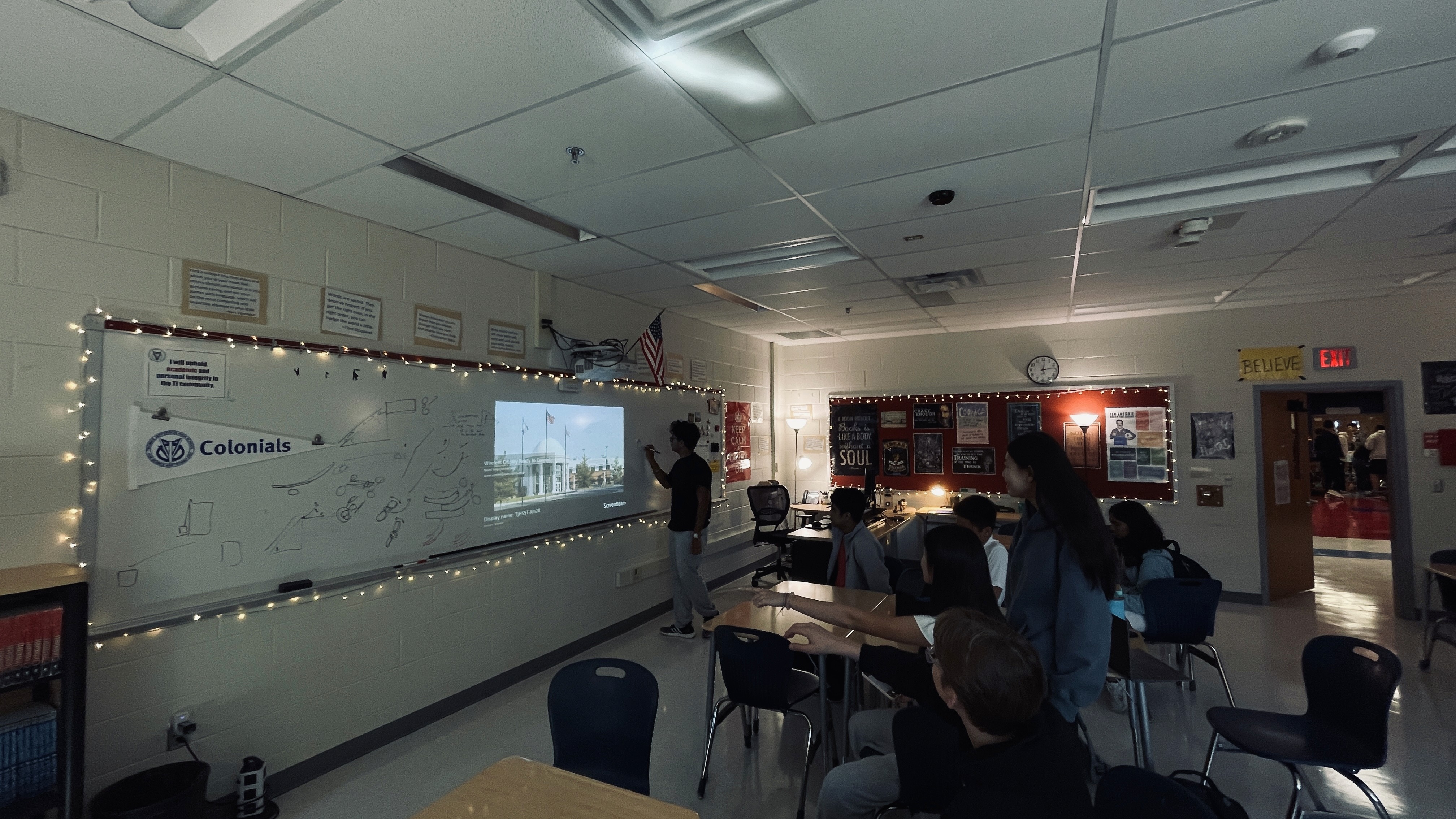 A dark glass bottle with a pump sits on a stone, surrounded by green leaves and textured background.