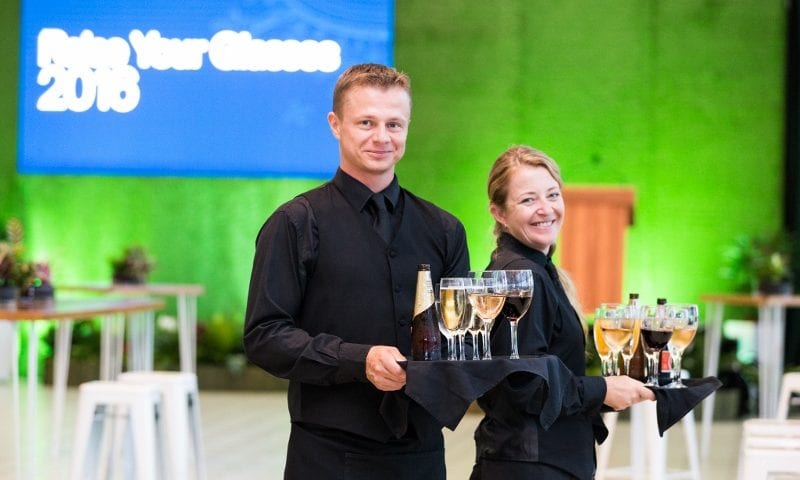 Front of House staff offering guests drinks on arrival