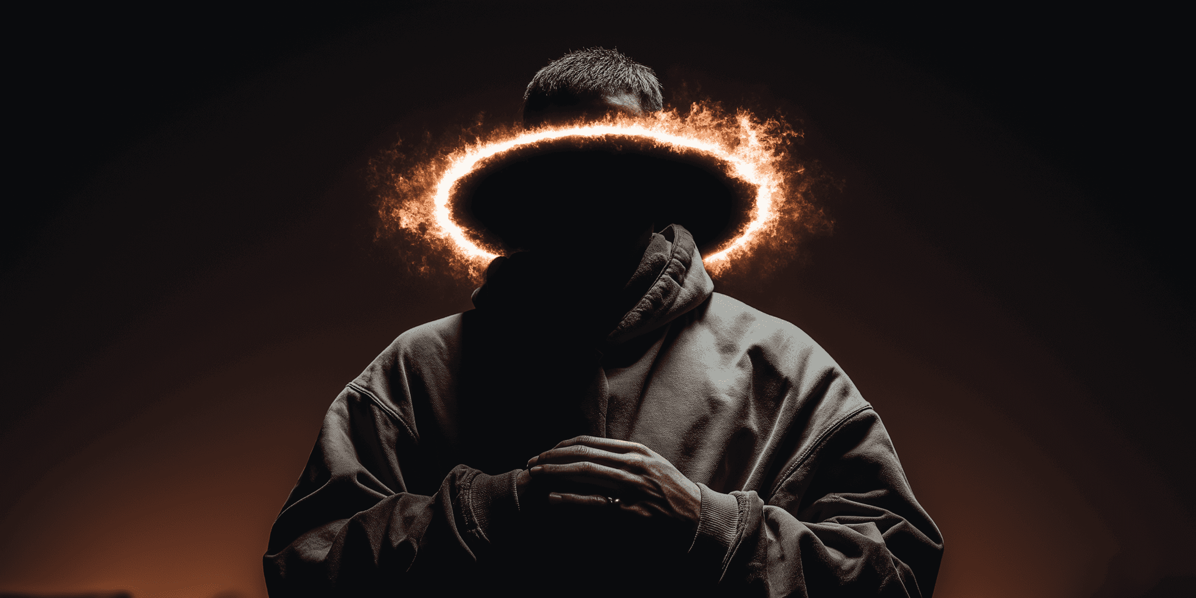 Person in hooded jacket sitting with head lowered inside a glowing halo circle