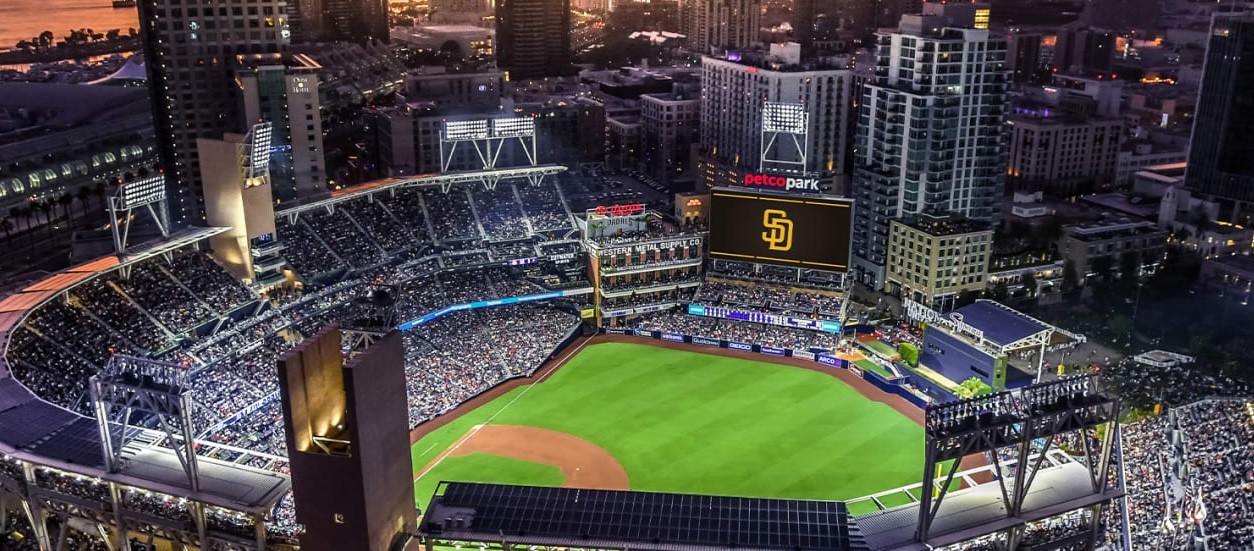 Skyview of Petco Park with Padres lit up on  bigscreen