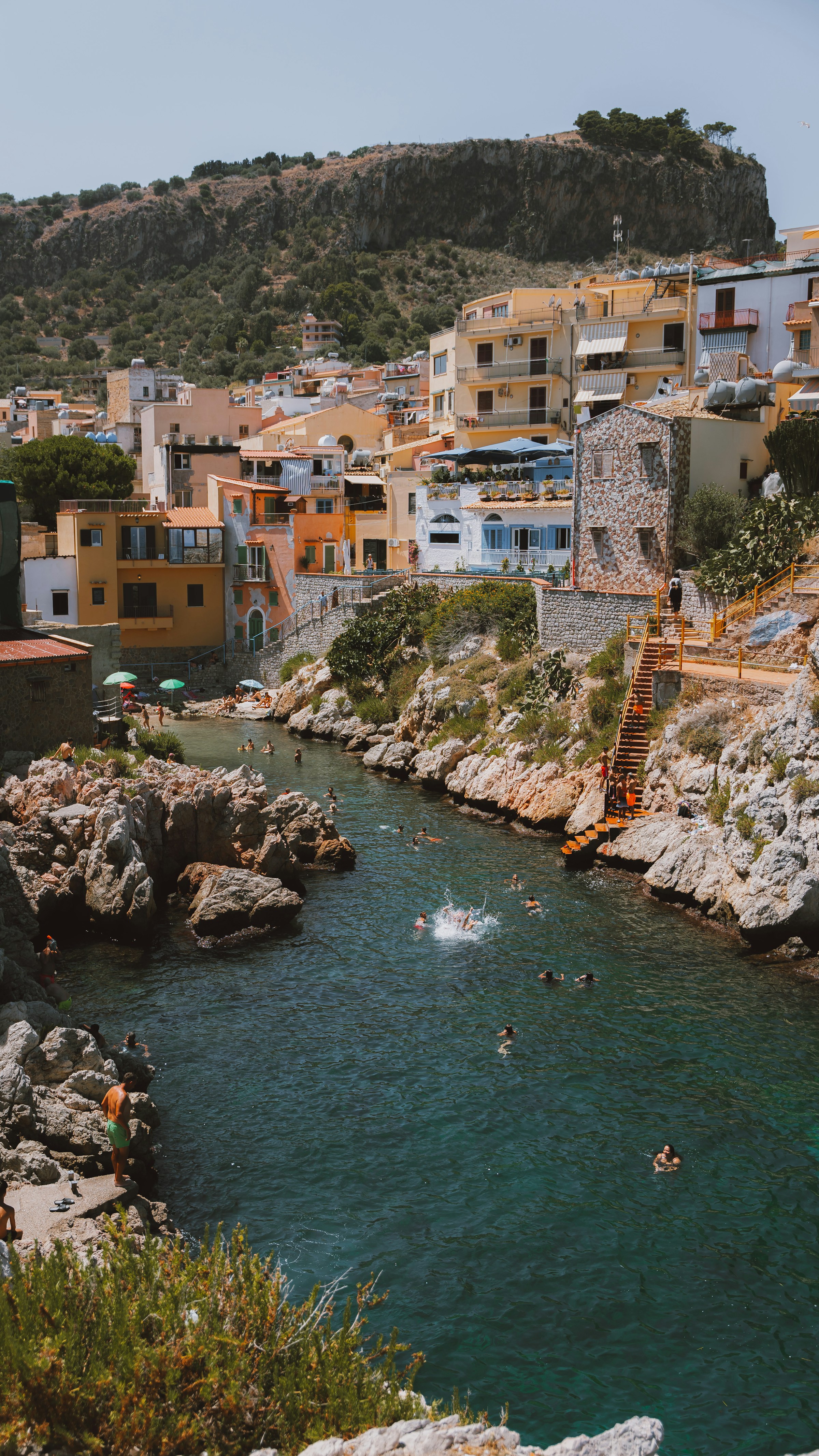 kids lying on a glass land and smiling