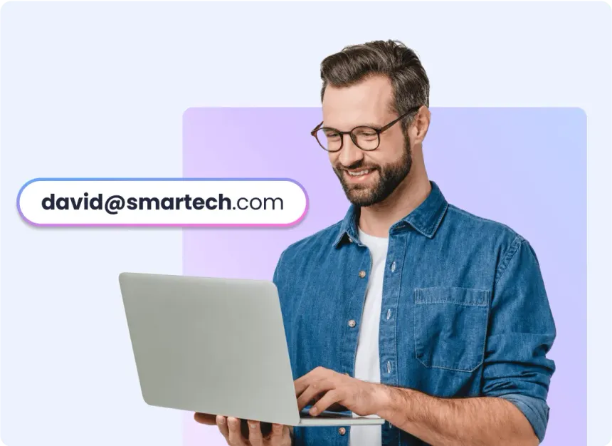 Man with laptop and a custom email of david@smartech.com floating next to him.
