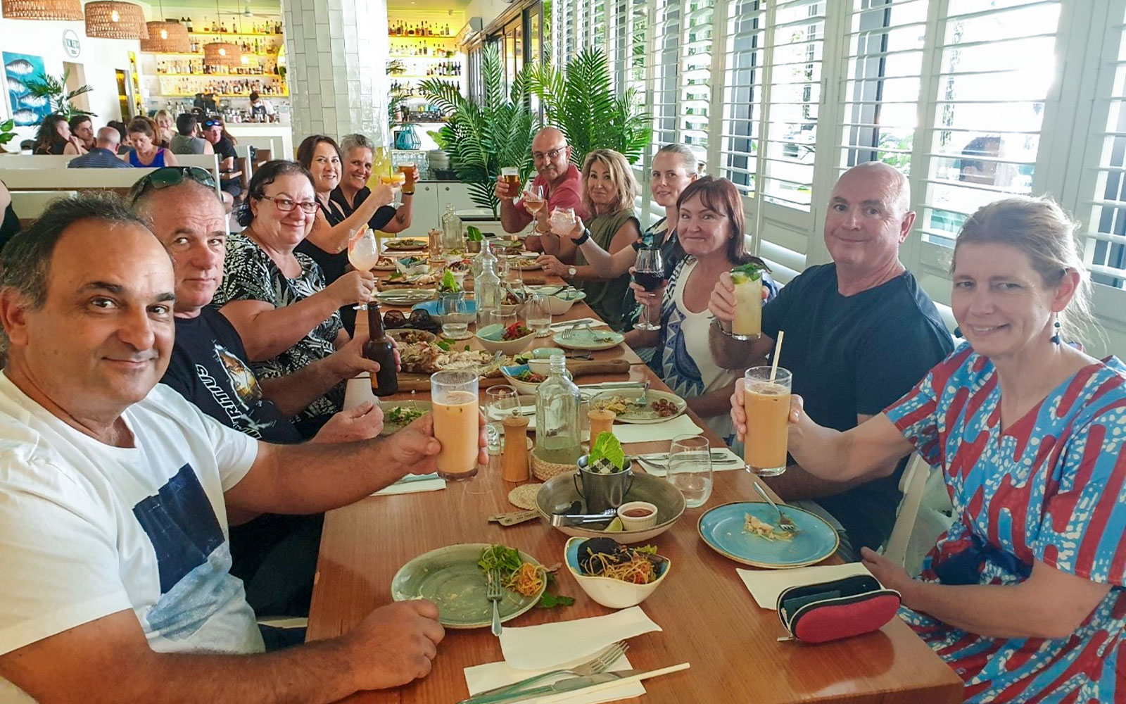 Group enjoying a gourmet meal at a restaurant during a 3.5-hour lunch or dinner art tour.