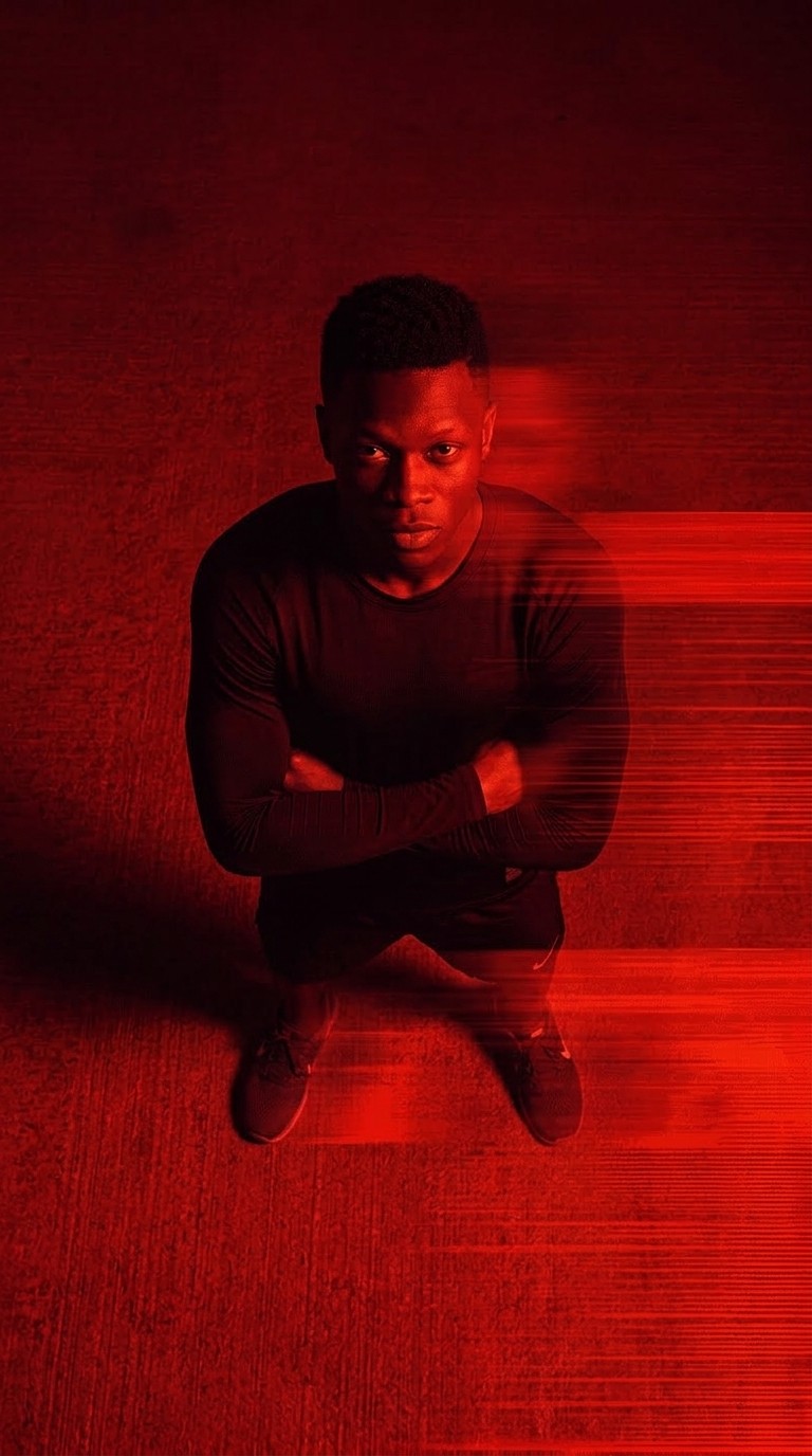 Close-up of a hallway with a horizontal motion blur in shades of red