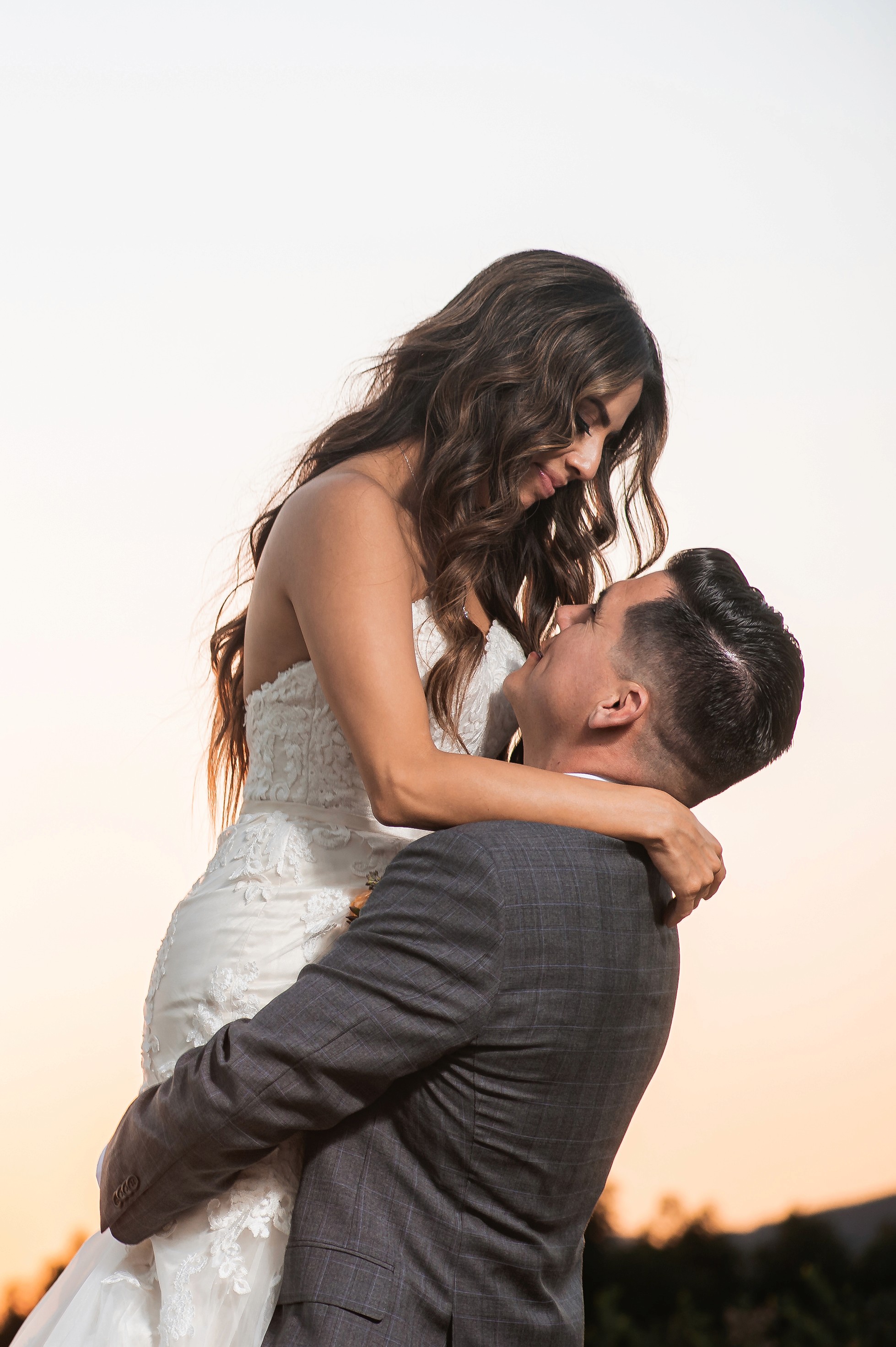 Flat lay wedding details with bouquet, rings, and sparkling bridal heels