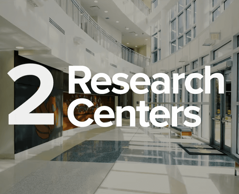 Educational film shot of institution building with graphics.