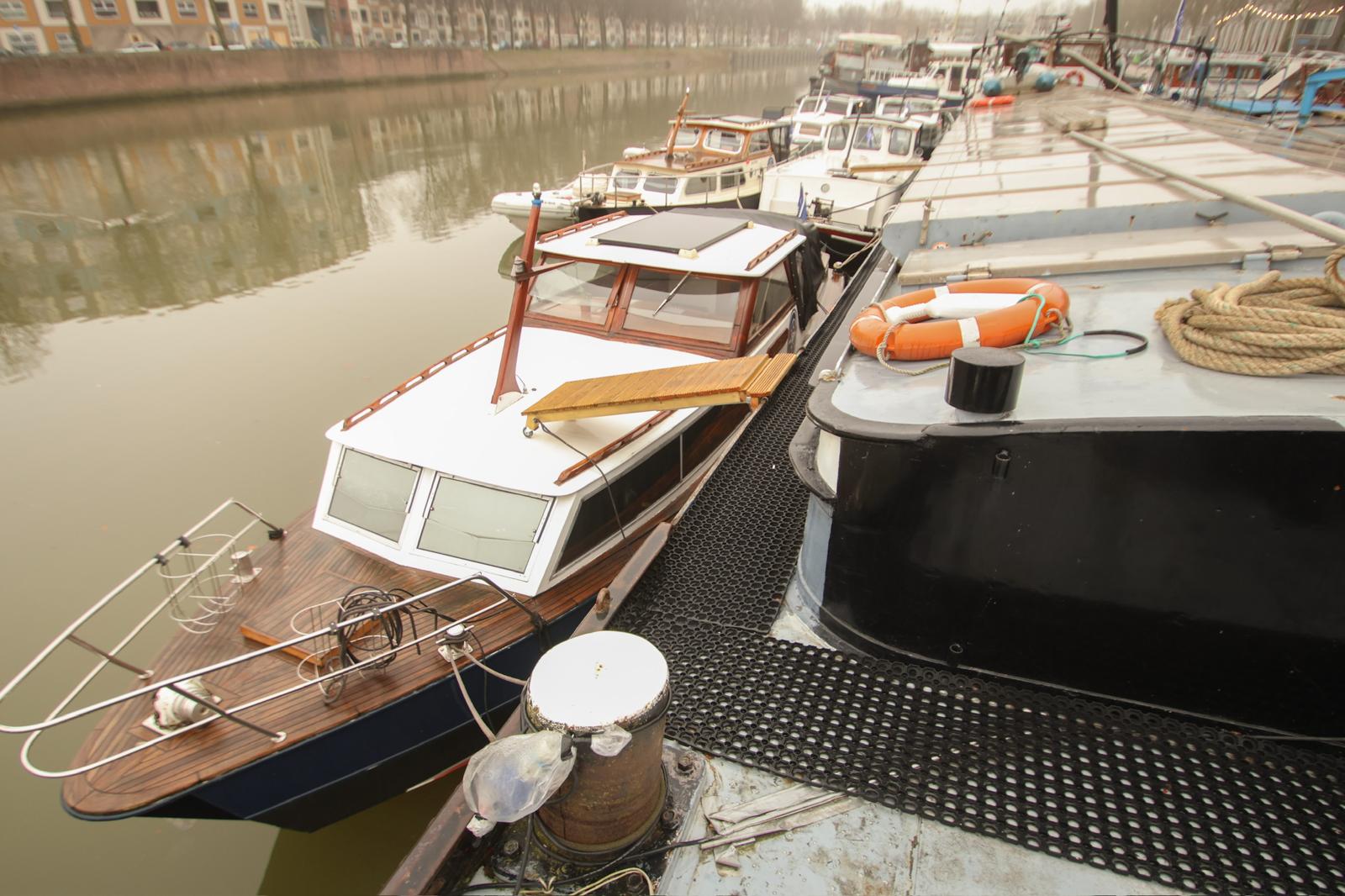 Modern office desk with angular design and leather chair