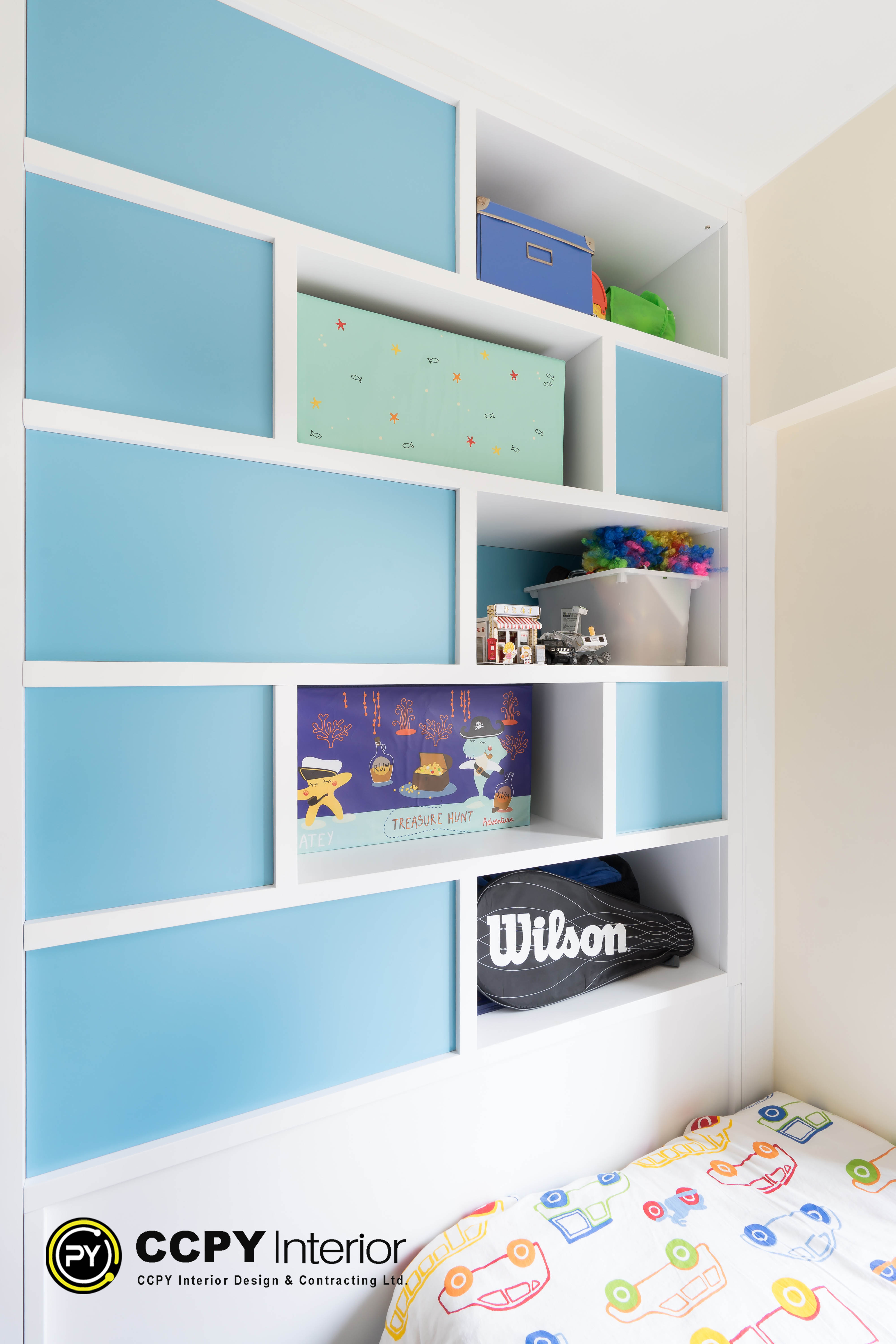 Blue modular wall panels provide a playful yet architectural storage solution inside Castello Block3.