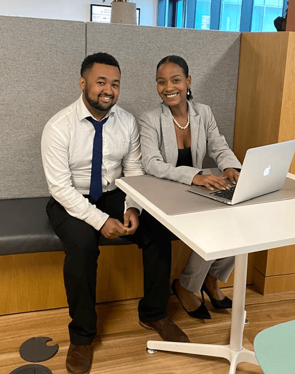 person sitting in a chair in front of a man