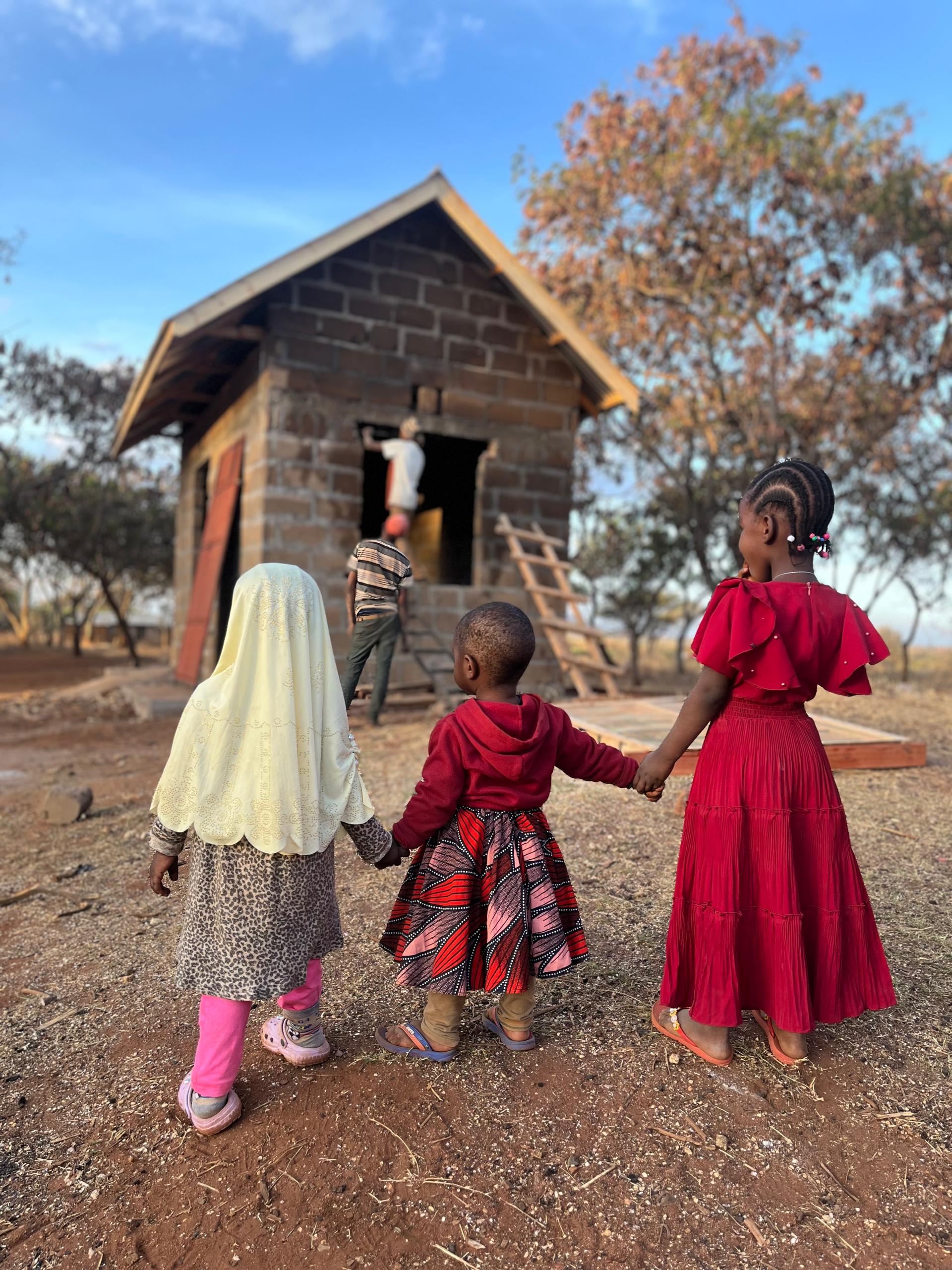 Little girls waching their new Kitchen