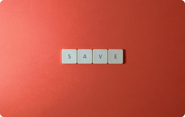 Four white square tiles with black letters arranged horizontally to spell the word 'SAVE'
