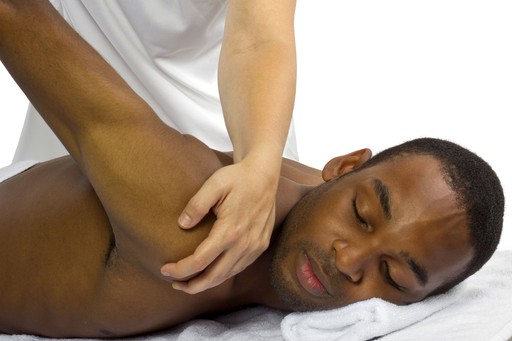 man getting treatment for a sore shoulder