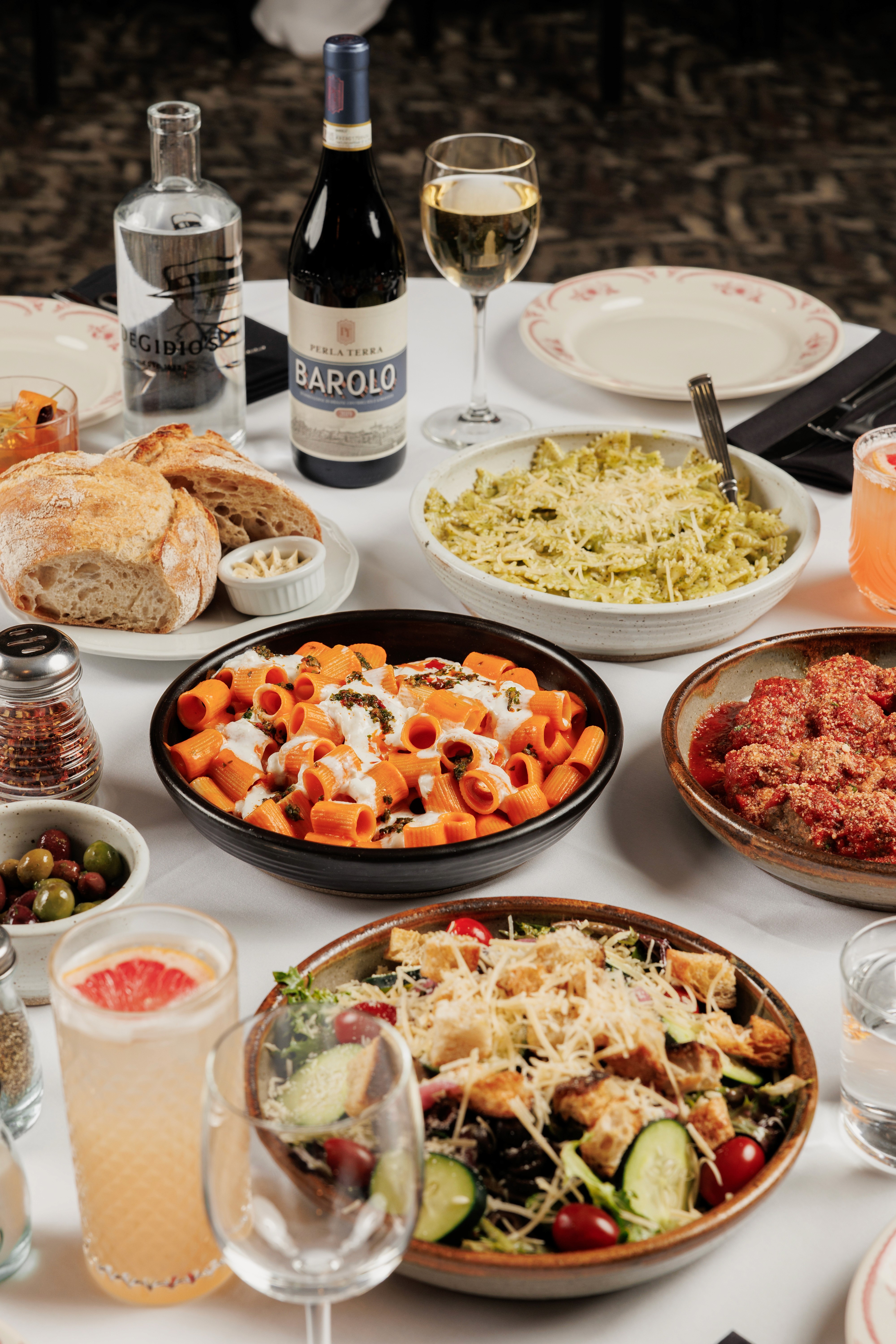 family style italian with rigatoni alla vodka, italian salad, meatballs and cocktails