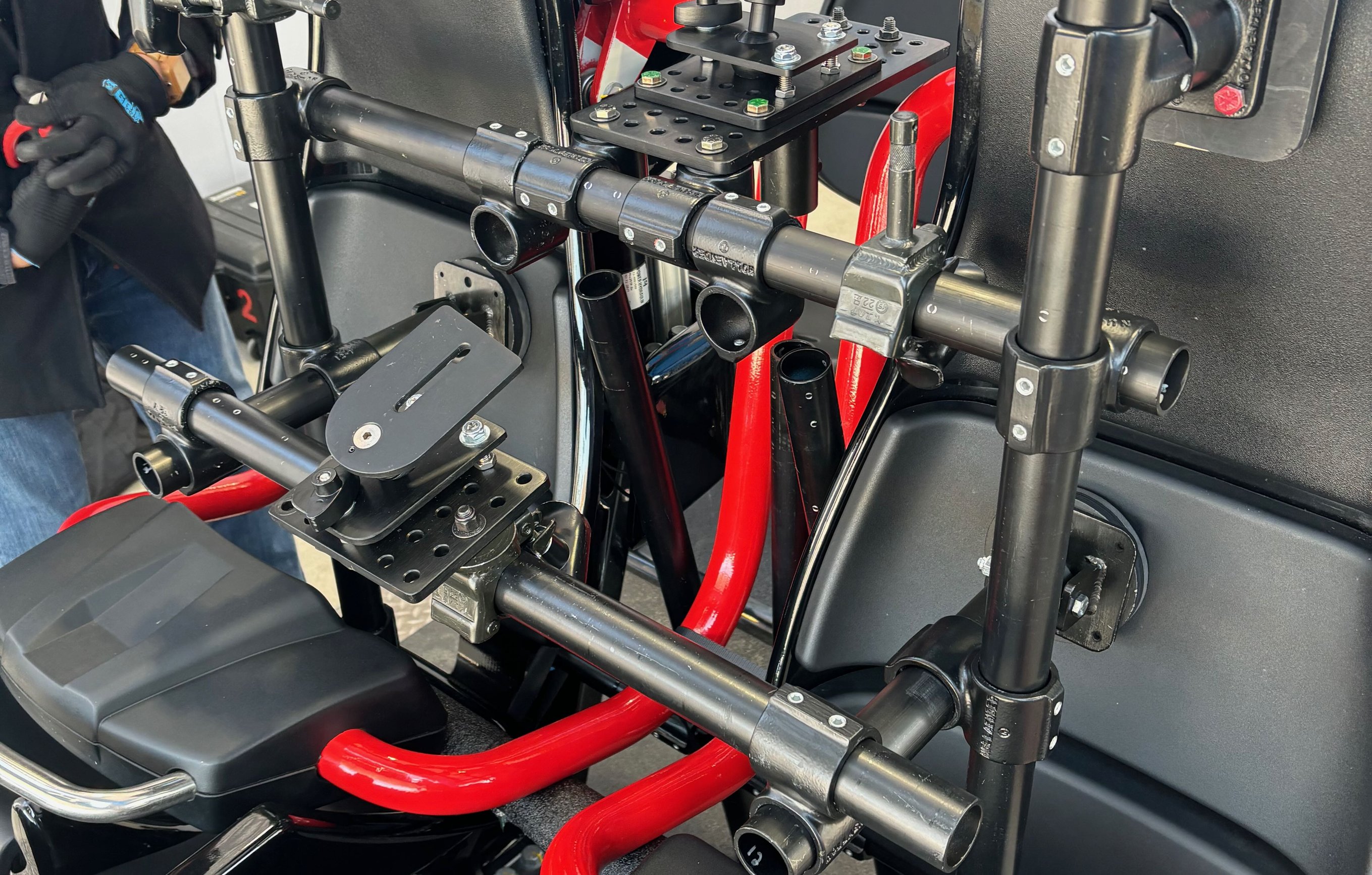 Complete two-camera hard-mount rig on a new Ohio roller coaster with DP Jeff Nolde, showing speedrail structure and ratchet straps securing the cameras to the car