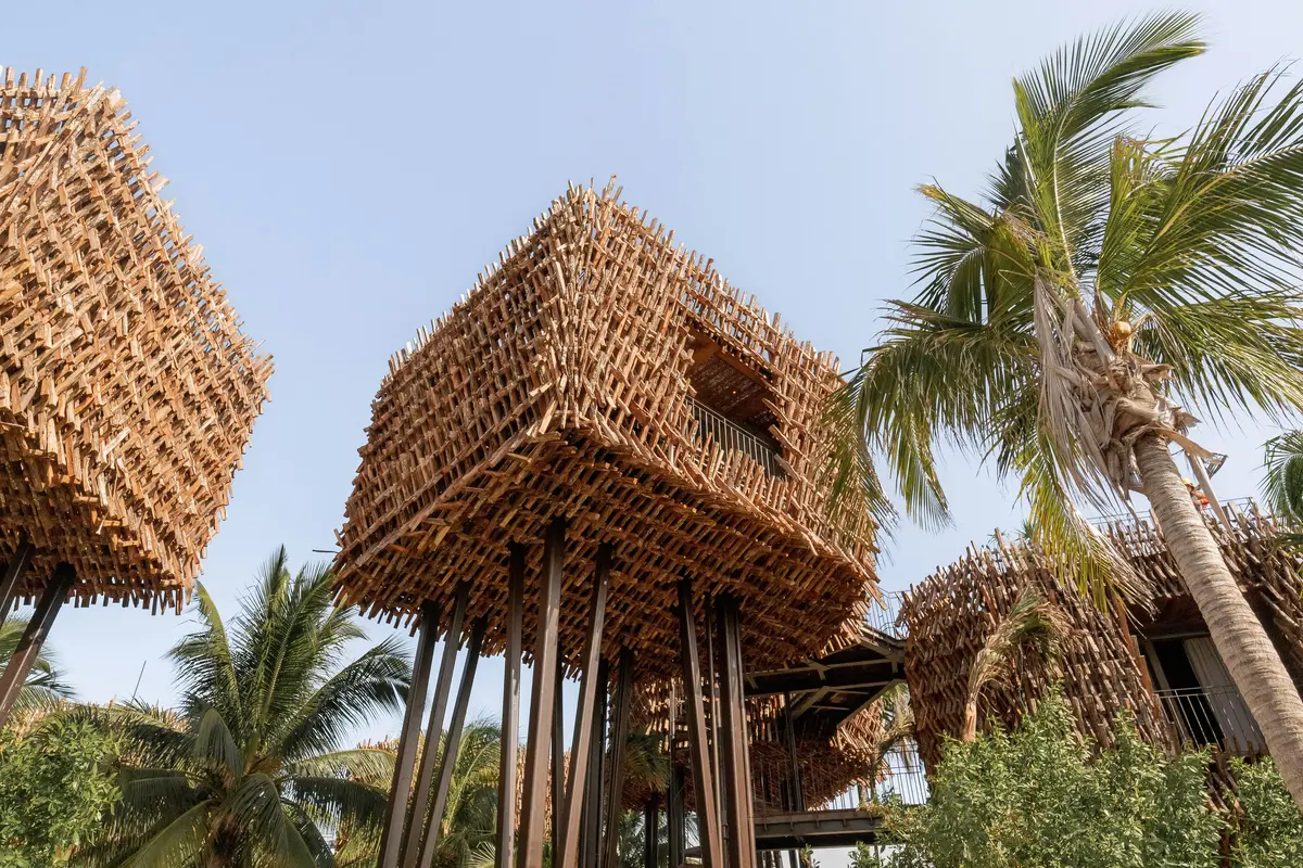 Unique and luxurious treehouse suite at Nomade Holbox in Holbox Mexico, surrounded by lush tropical plants and ocean views