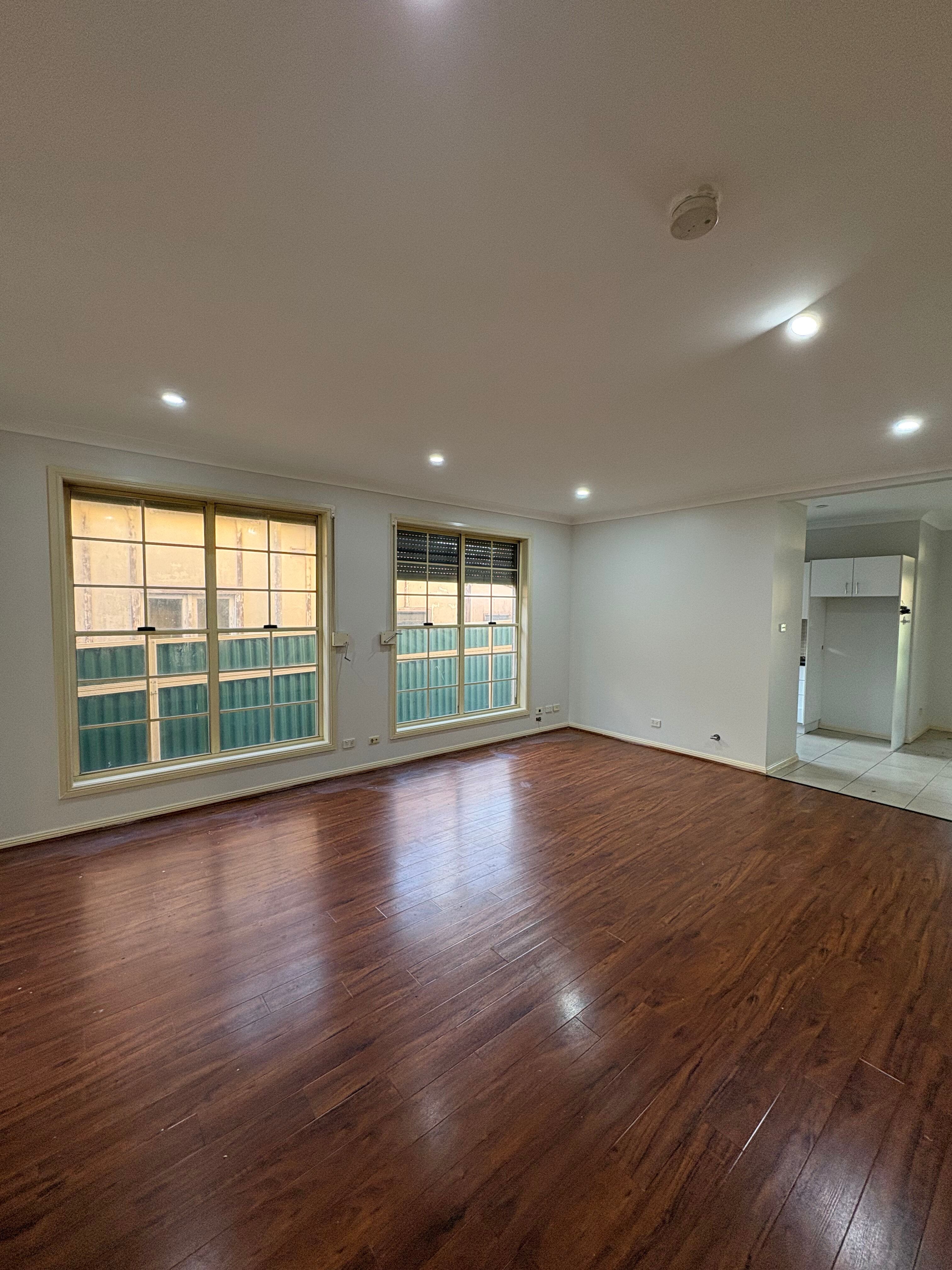 white sofa chair near fireplace