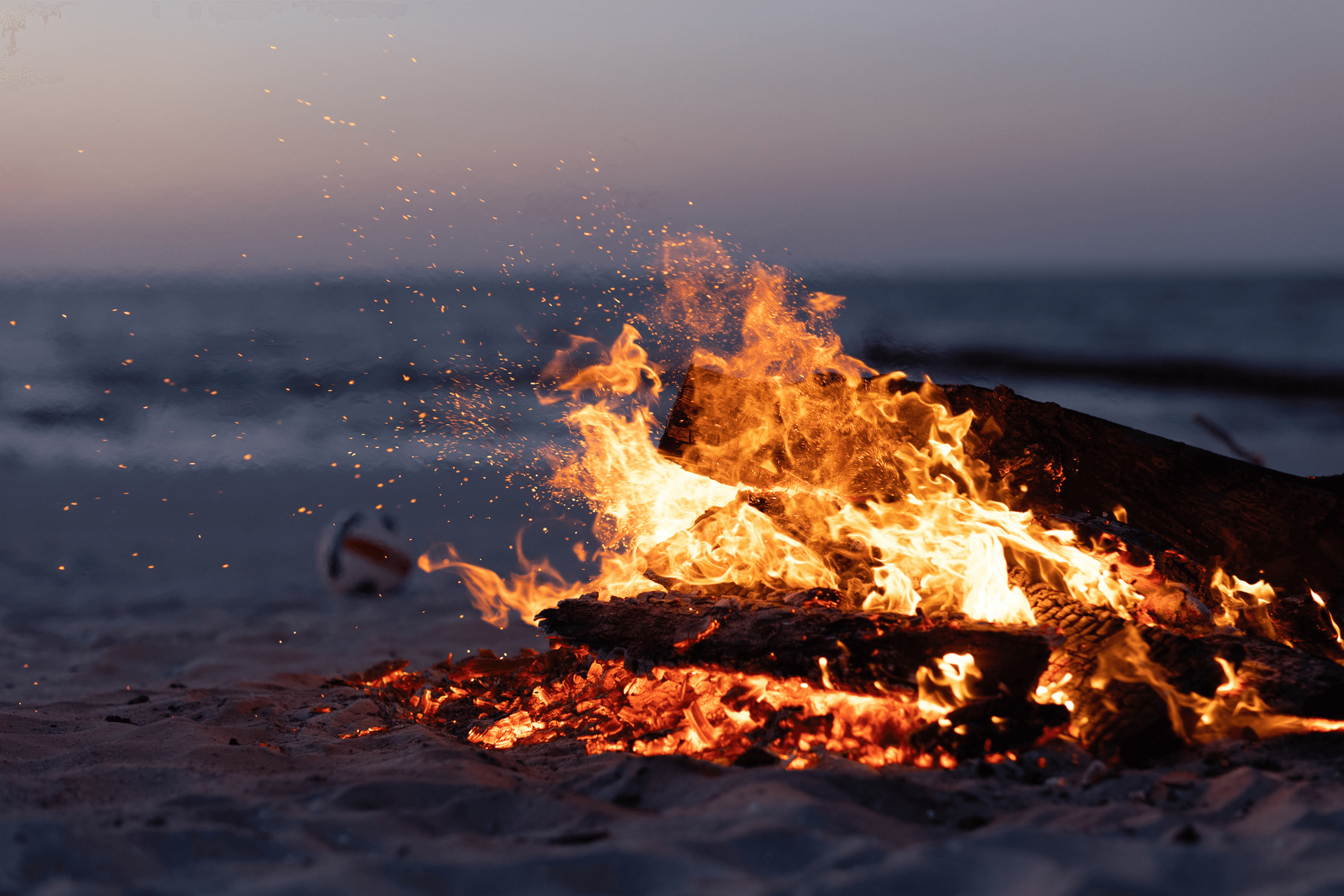 Bonfire on a beach at dusk