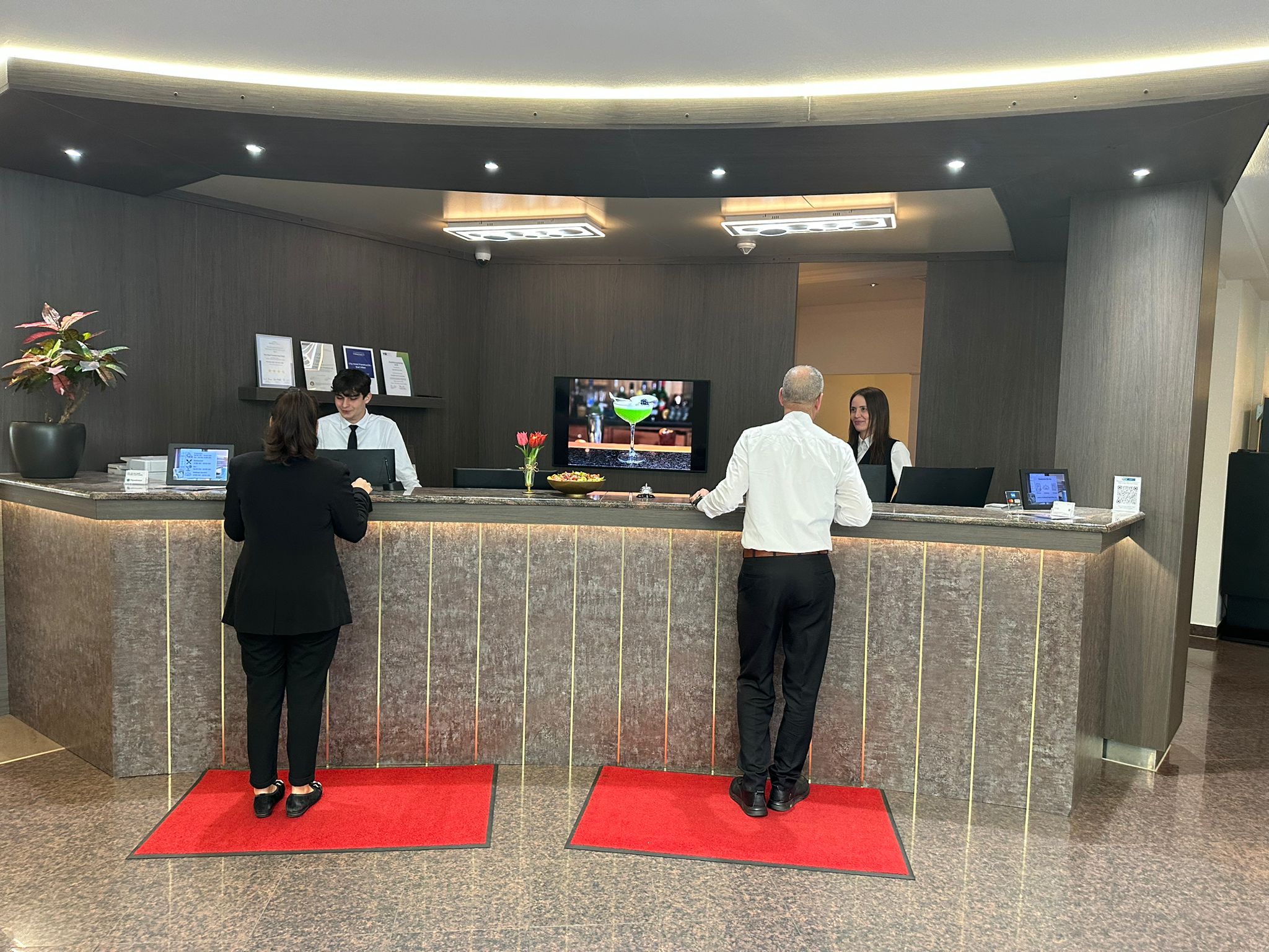 Macro shot of shallow seawater over smooth pebbles, sunlight refracting through the clear turquoise surface. 