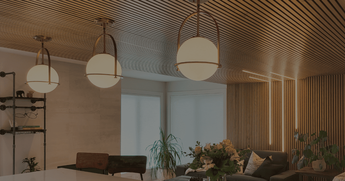 Image of Luxury gold chandelier in modern interior design with marble walls and large window. KHD Homes design-build.