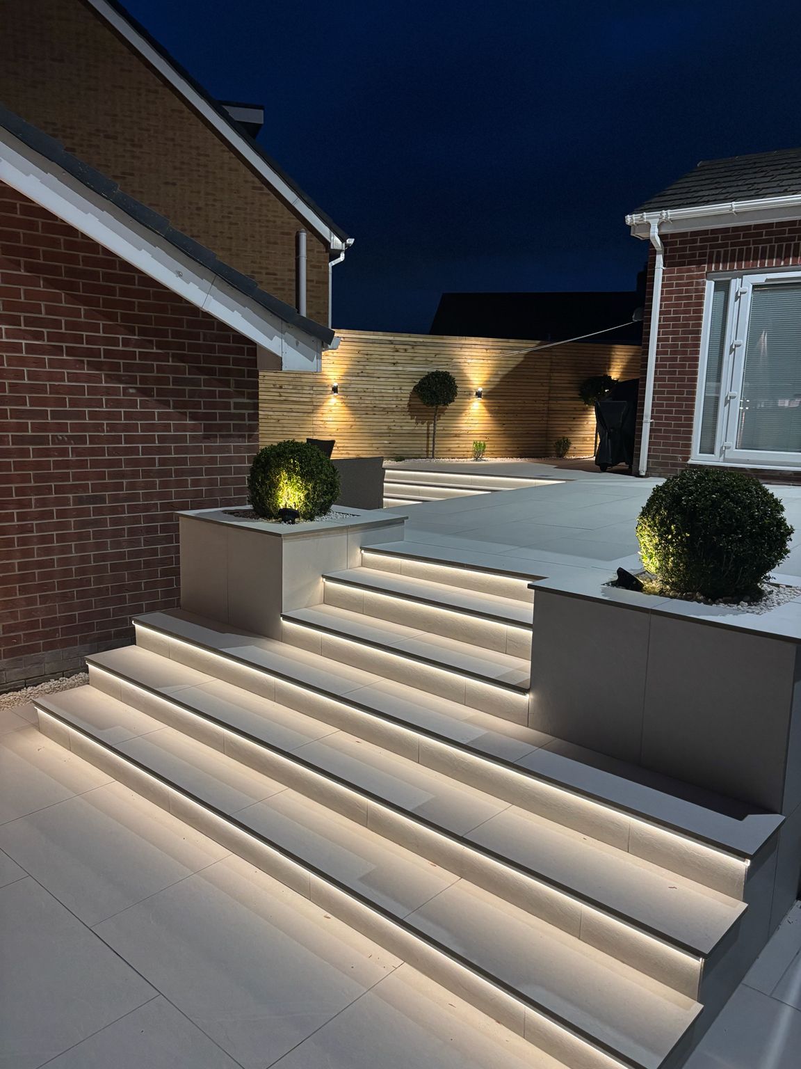 Illuminated porcelain garden steps and raised planters in Childwall, Liverpool