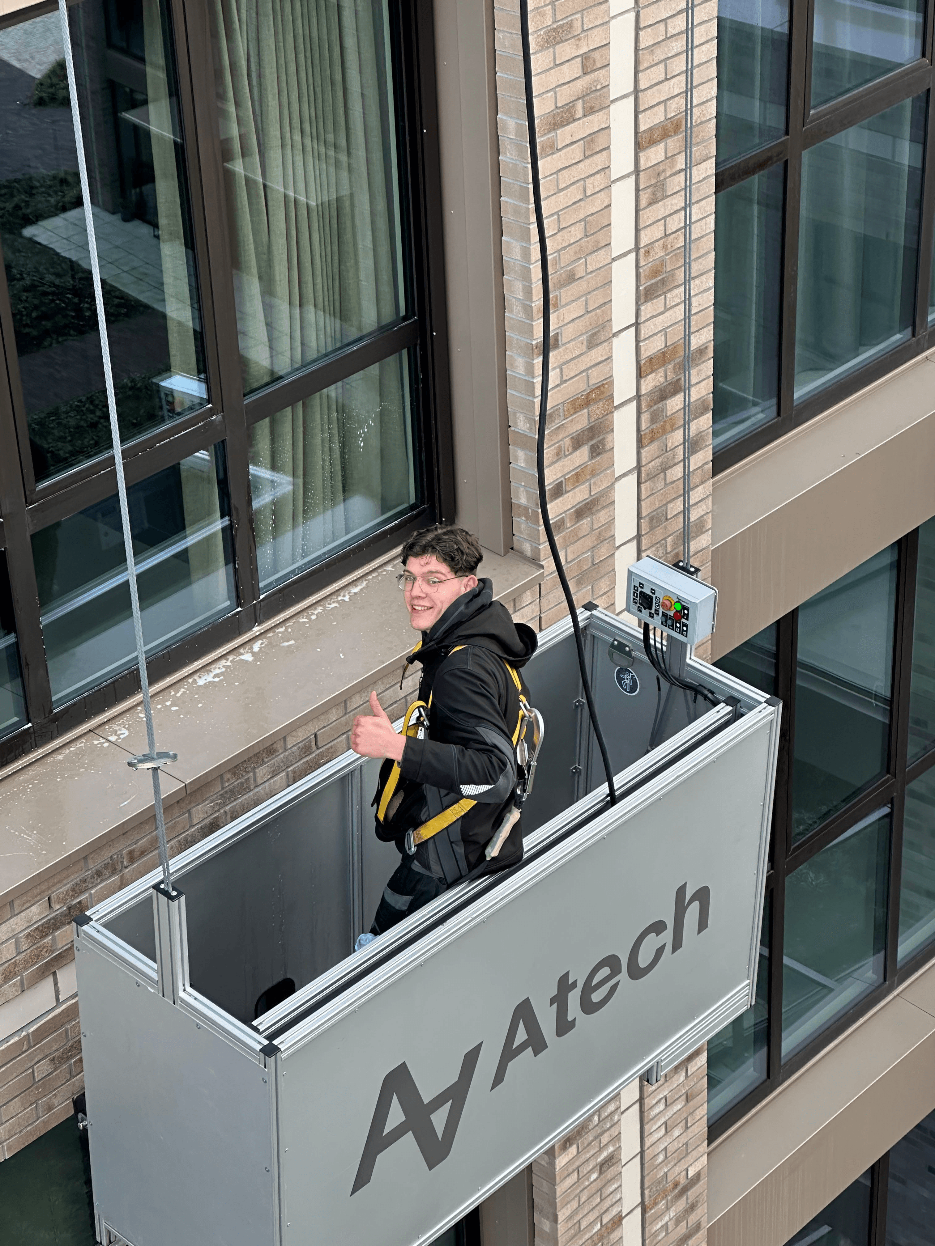 five children smiling while doing peace hand sign